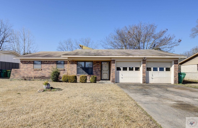 ranch-style house featuring a garage and a front lawn