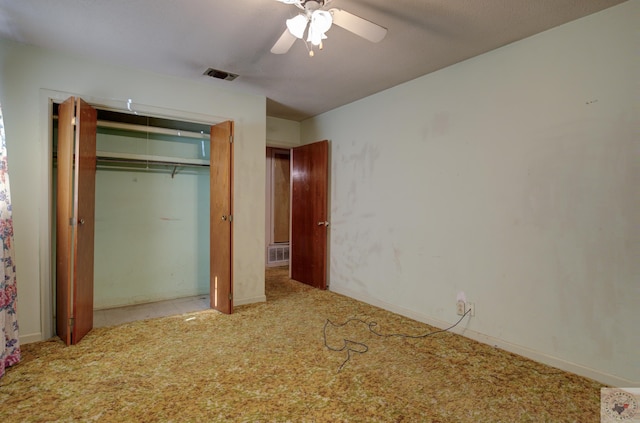 unfurnished bedroom with light colored carpet, ceiling fan, and a closet