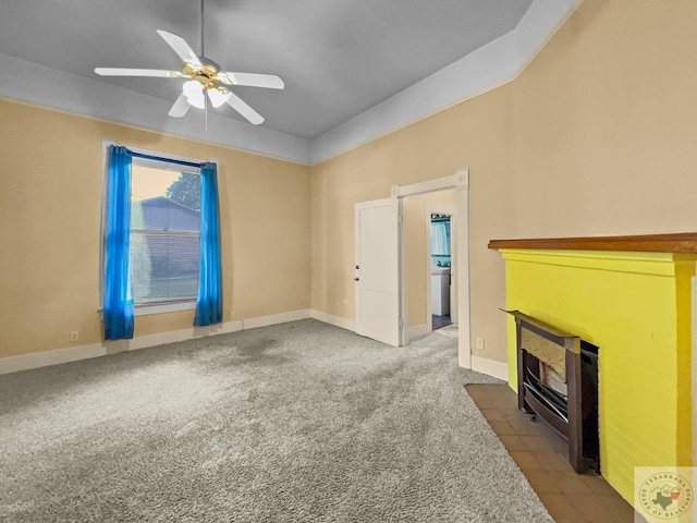 unfurnished living room with ceiling fan, carpet, and a fireplace