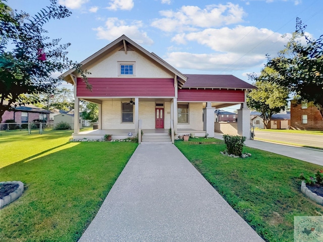 view of front of property with covered porch and a front lawn