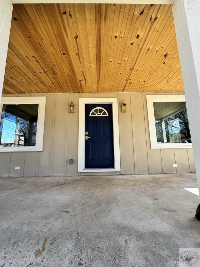 property entrance with board and batten siding