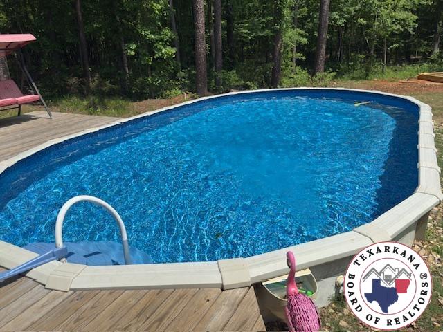 3059 Mc 22, Fouke, AR 71837 - outdoor pool with a deck