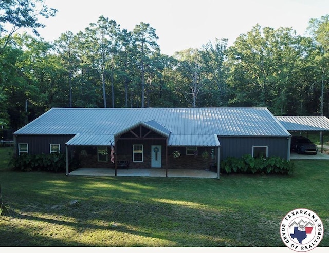 3059 Mc 22, Fouke, AR 71837 - view of front of property with a front lawn and a metal roof