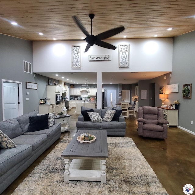 3059 Mc 22, Fouke, AR 71837 - living area with a high ceiling, finished concrete flooring, wooden ceiling, ceiling fan, and recessed lighting