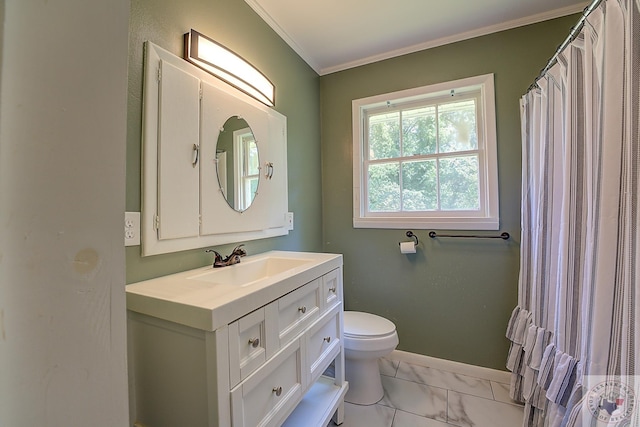 bathroom with vanity, toilet, and crown molding