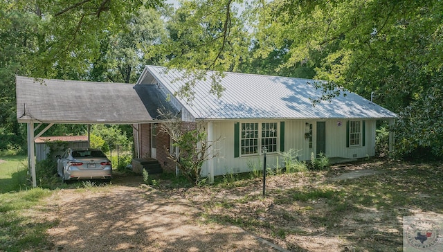 view of front of home featuring a carport