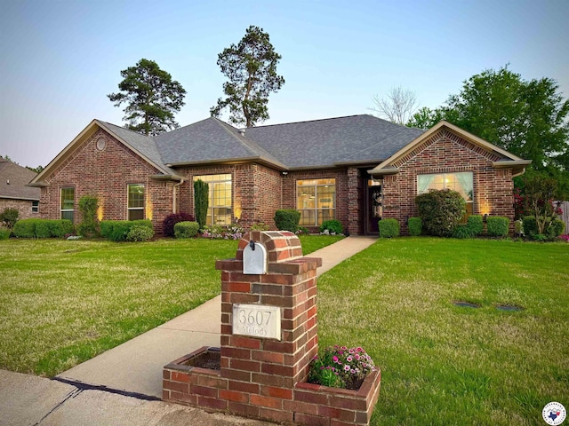 3607 Melody Ln, Texarkana, TX 75503 - single story home featuring a front lawn, roof with shingles, and brick siding