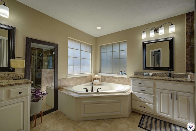 3607 Melody Ln, Texarkana, TX 75503 - bathroom with a bath, tile patterned floors, a sink, two vanities, and a stall shower