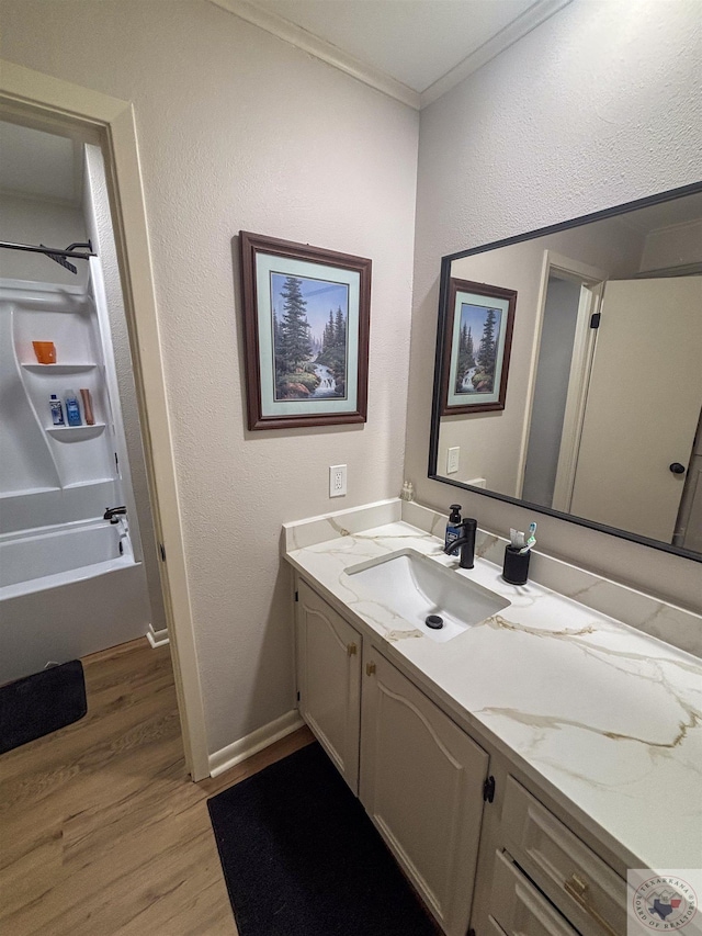 111 Oak St, New Boston, TX 75570 - bathroom featuring shower / bathing tub combination, vanity, ornamental molding, baseboards, and wood finished floors