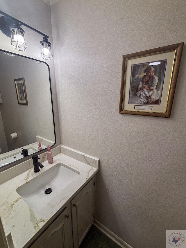 111 Oak St, New Boston, TX 75570 - bathroom with a textured wall and vanity