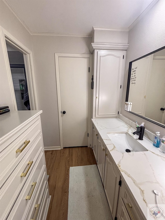 111 Oak St, New Boston, TX 75570 - bathroom with crown molding, wood finished floors, and vanity