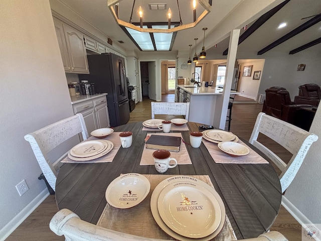 111 Oak St, New Boston, TX 75570 - dining area featuring a notable chandelier, dark wood-style floors, baseboards, and visible vents