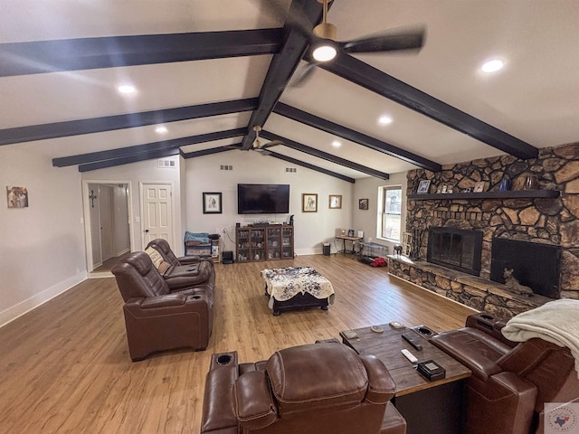 111 Oak St, New Boston, TX 75570 - living area featuring baseboards, a fireplace, wood finished floors, a ceiling fan, and vaulted ceiling with beams