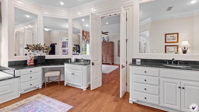 6804 Springwood Cir, Texarkana, TX 75503 - full bathroom featuring crown molding, vanity, wood finished floors, and recessed lighting