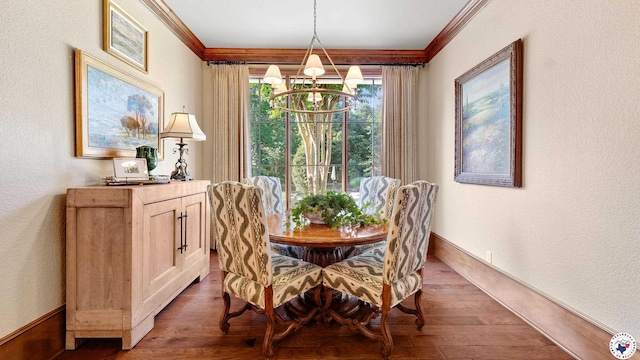 6804 Springwood Cir, Texarkana, TX 75503 - dining area featuring crown molding, wood finished floors, a textured wall, and a chandelier