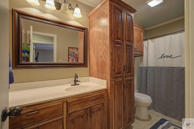 bathroom featuring toilet, vanity, and ornamental molding