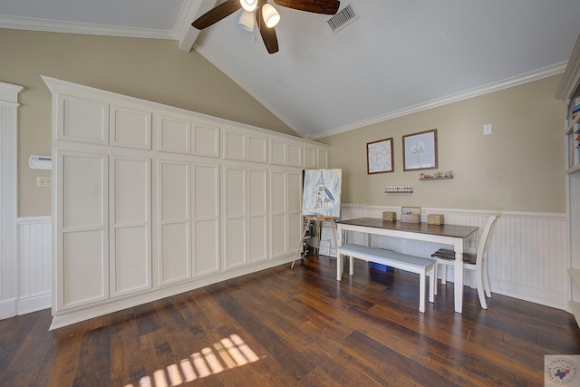 dining area featuring ceiling fan, dark hardwood / wood-style floors, crown molding, and vaulted ceiling with beams