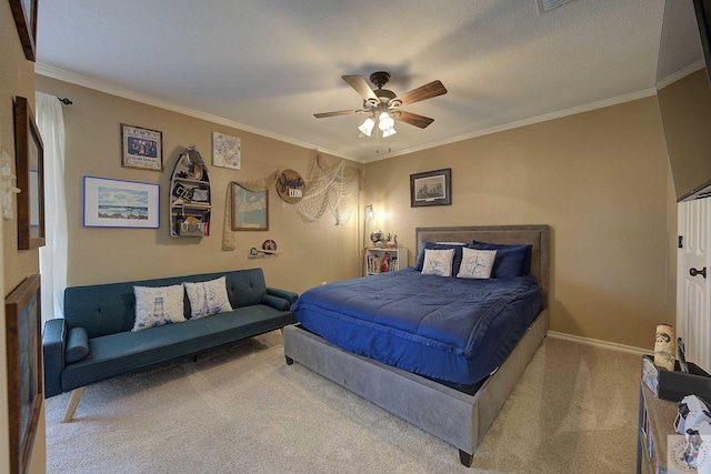 carpeted bedroom featuring ceiling fan, a textured ceiling, and crown molding