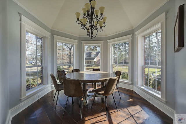 sunroom with lofted ceiling and a chandelier