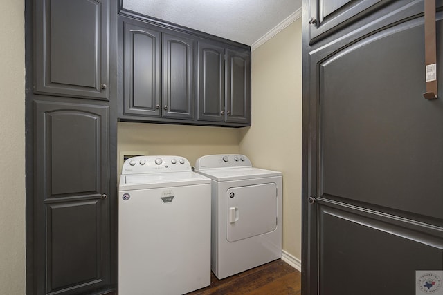 laundry room with a textured ceiling, washer and clothes dryer, dark wood-type flooring, cabinets, and crown molding