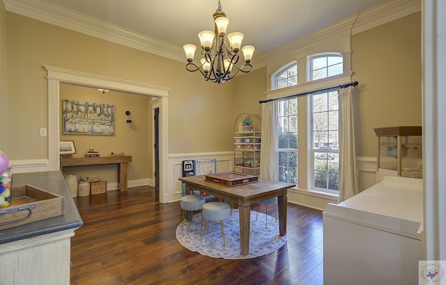 office featuring dark hardwood / wood-style flooring, a notable chandelier, and ornamental molding