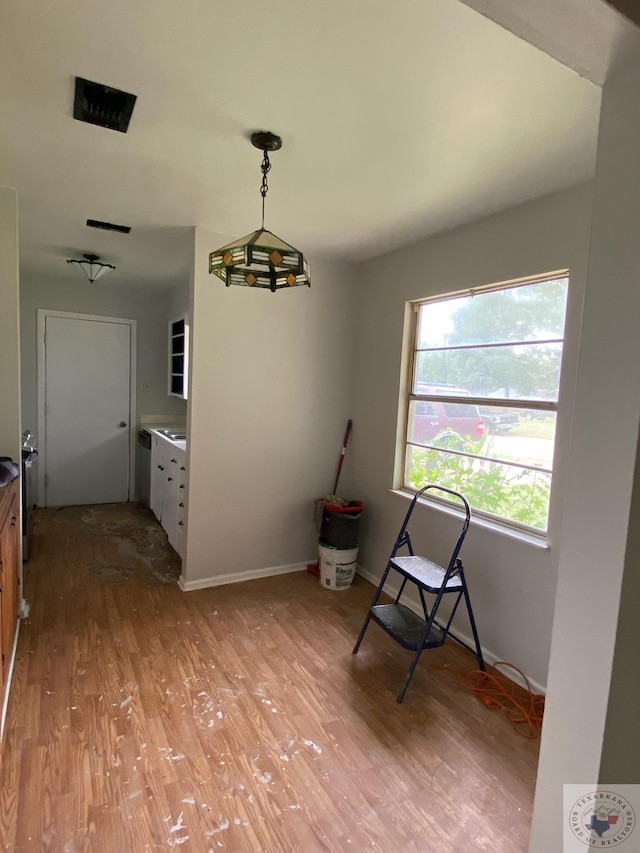 unfurnished room with light wood-type flooring