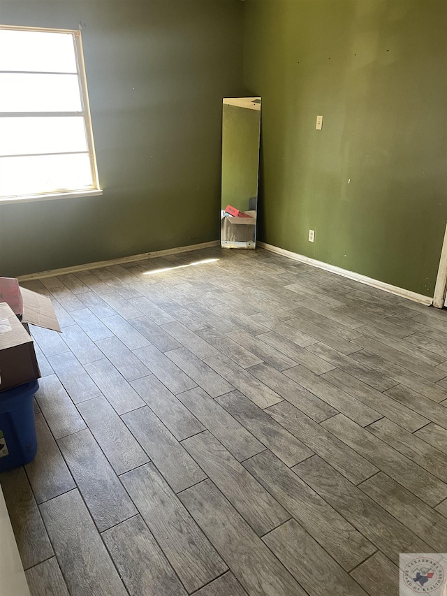 empty room with light hardwood / wood-style flooring