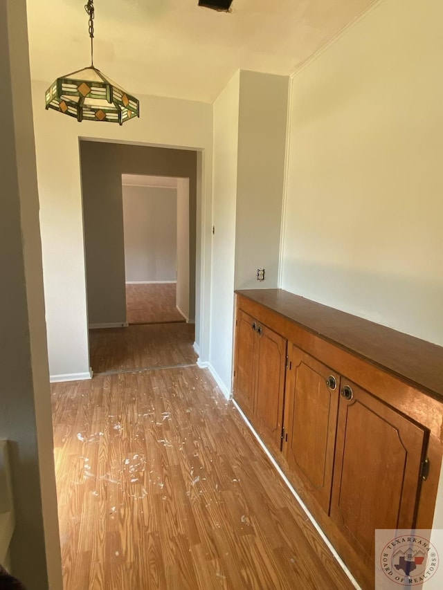 hall with light hardwood / wood-style floors