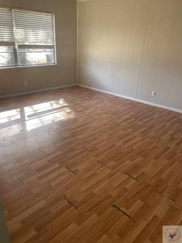 empty room featuring dark hardwood / wood-style flooring