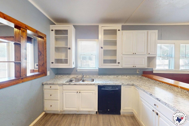 2006 Walnut St, Texarkana, TX 75501 - kitchen featuring stainless steel range with electric stovetop, black microwave, white cabinetry, and light wood-style flooring