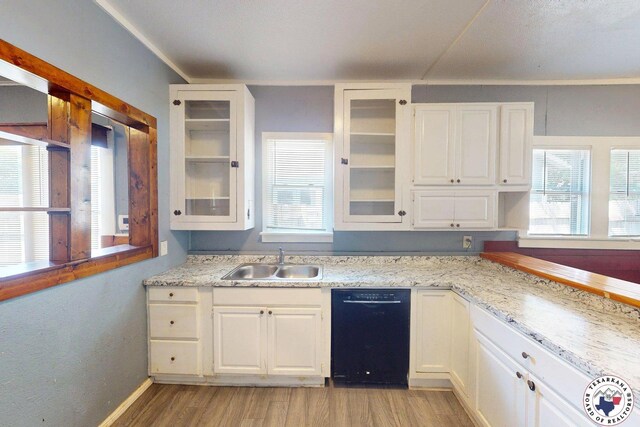 2006 Walnut St, Texarkana, TX 75501 - kitchen featuring stainless steel range with electric stovetop, black microwave, white cabinetry, and light wood-style flooring