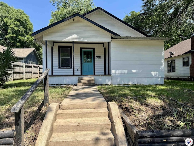2006 Walnut St, Texarkana, TX 75501 - view of front of house with fence and a porch
