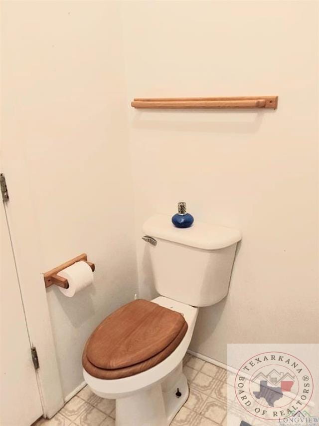 bathroom featuring toilet