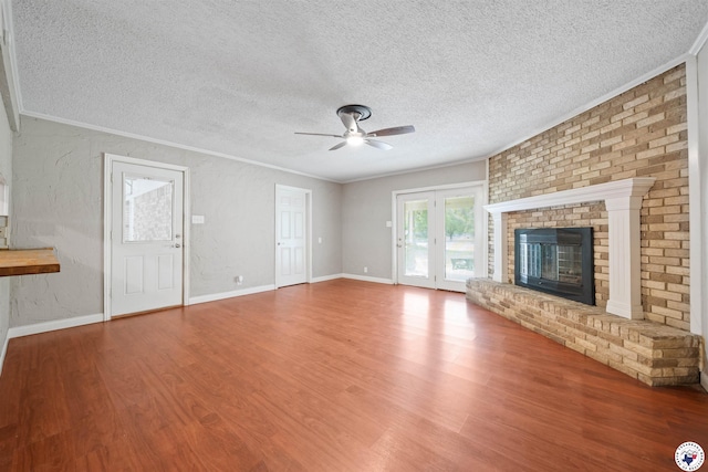 218 Redwood Dr, Texarkana, TX 75501 - unfurnished living room featuring crown molding, wood finished floors, a textured ceiling, and a ceiling fan