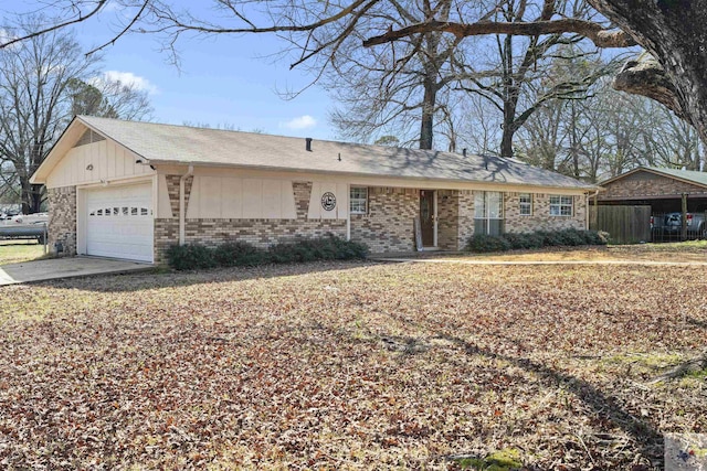 single story home with concrete driveway, brick siding, and an attached garage