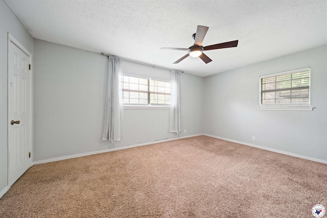 218 Redwood Dr, Texarkana, TX 75501 - unfurnished room featuring carpet floors, a textured ceiling, a ceiling fan, and baseboards