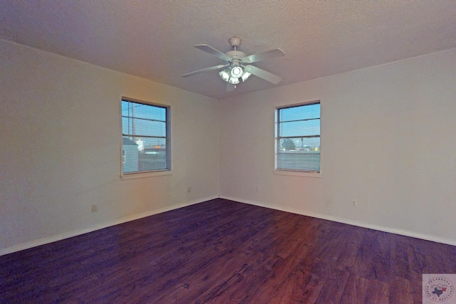 empty room with hardwood / wood-style flooring, a textured ceiling, and ceiling fan