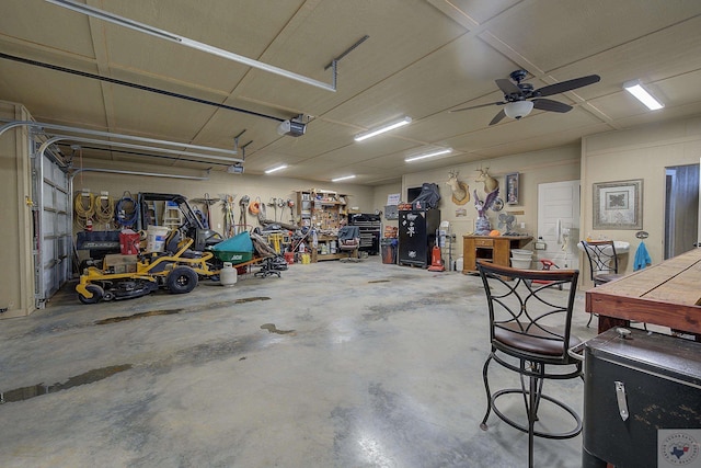 garage with a ceiling fan and a garage door opener