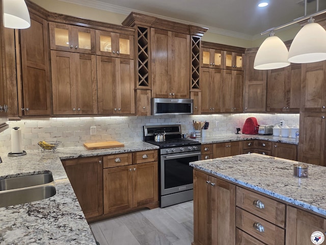 6133 Timberwood Ln, Texarkana, AR 71854 - kitchen with appliances with stainless steel finishes, crown molding, decorative backsplash, hanging light fixtures, and glass insert cabinets