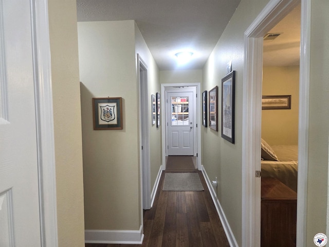6133 Timberwood Ln, Texarkana, AR 71854 - hallway featuring dark wood finished floors and baseboards