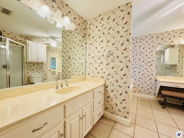 full bath with a stall shower, visible vents, baseboards, tile patterned flooring, and wallpapered walls