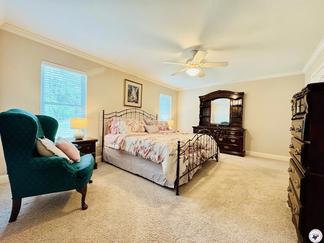 bedroom featuring baseboards, ceiling fan, light carpet, and crown molding