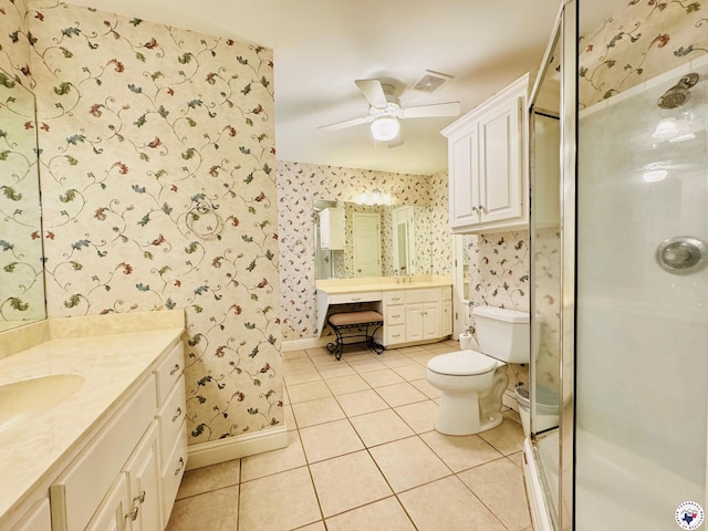 bathroom featuring ceiling fan, tile patterned floors, a stall shower, visible vents, and wallpapered walls