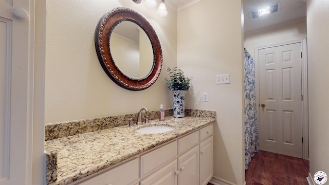7109 Forest Oak Dr, Texarkana, AR 71854 - bathroom featuring ornamental molding, wood finished floors, and vanity