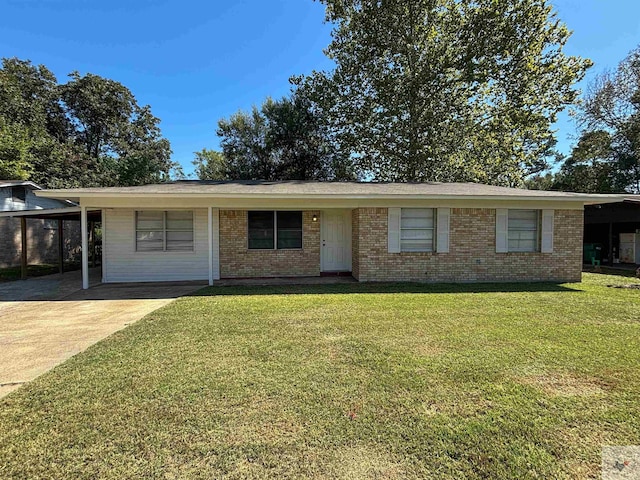 ranch-style house with an attached carport, brick siding, driveway, and a front lawn