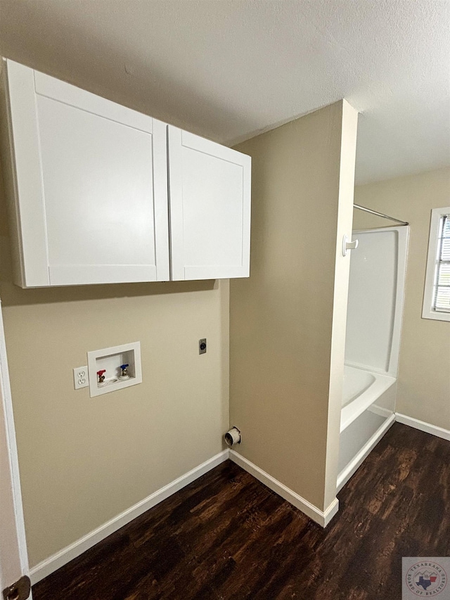 laundry area featuring a textured ceiling, hookup for an electric dryer, washer hookup, wood finished floors, and baseboards