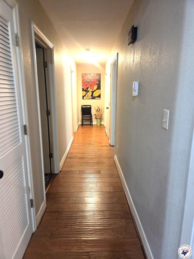30 Hickory Oak Ln, Texarkana, TX 75501 - hall with baseboards, a textured wall, and light wood-type flooring
