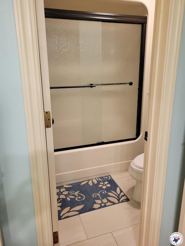 30 Hickory Oak Ln, Texarkana, TX 75501 - bathroom with enclosed tub / shower combo, tile patterned flooring, and toilet