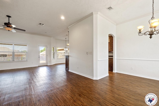 3604 Melody Ln, Texarkana, TX 75503 - spare room featuring arched walkways, crown molding, a chandelier, a ceiling fan, and dark wood-type flooring