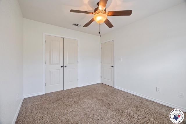 3604 Melody Ln, Texarkana, TX 75503 - unfurnished bedroom featuring carpet, a closet, baseboards, and ceiling fan